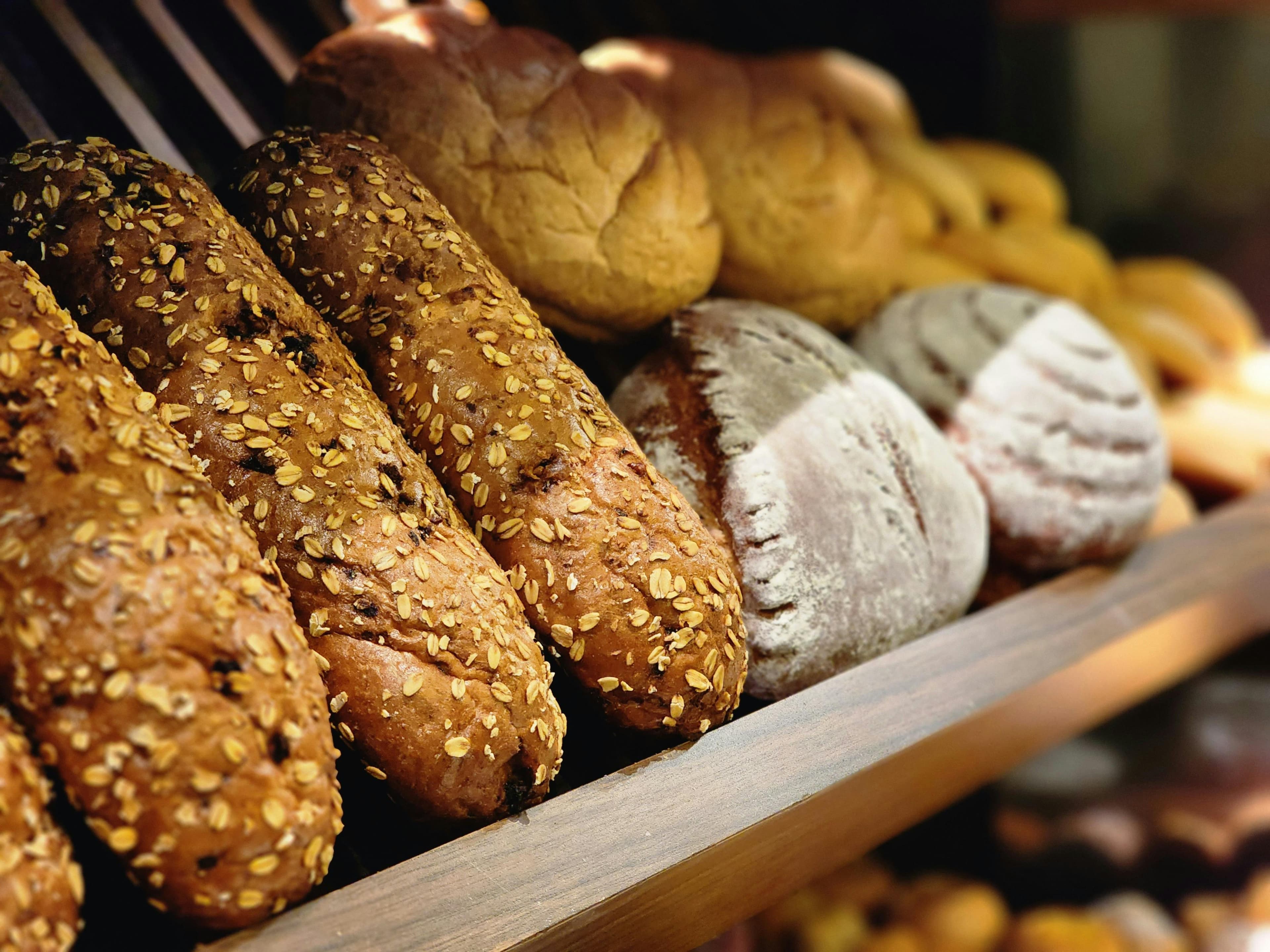Artisan bread loaves on a bakery shelf